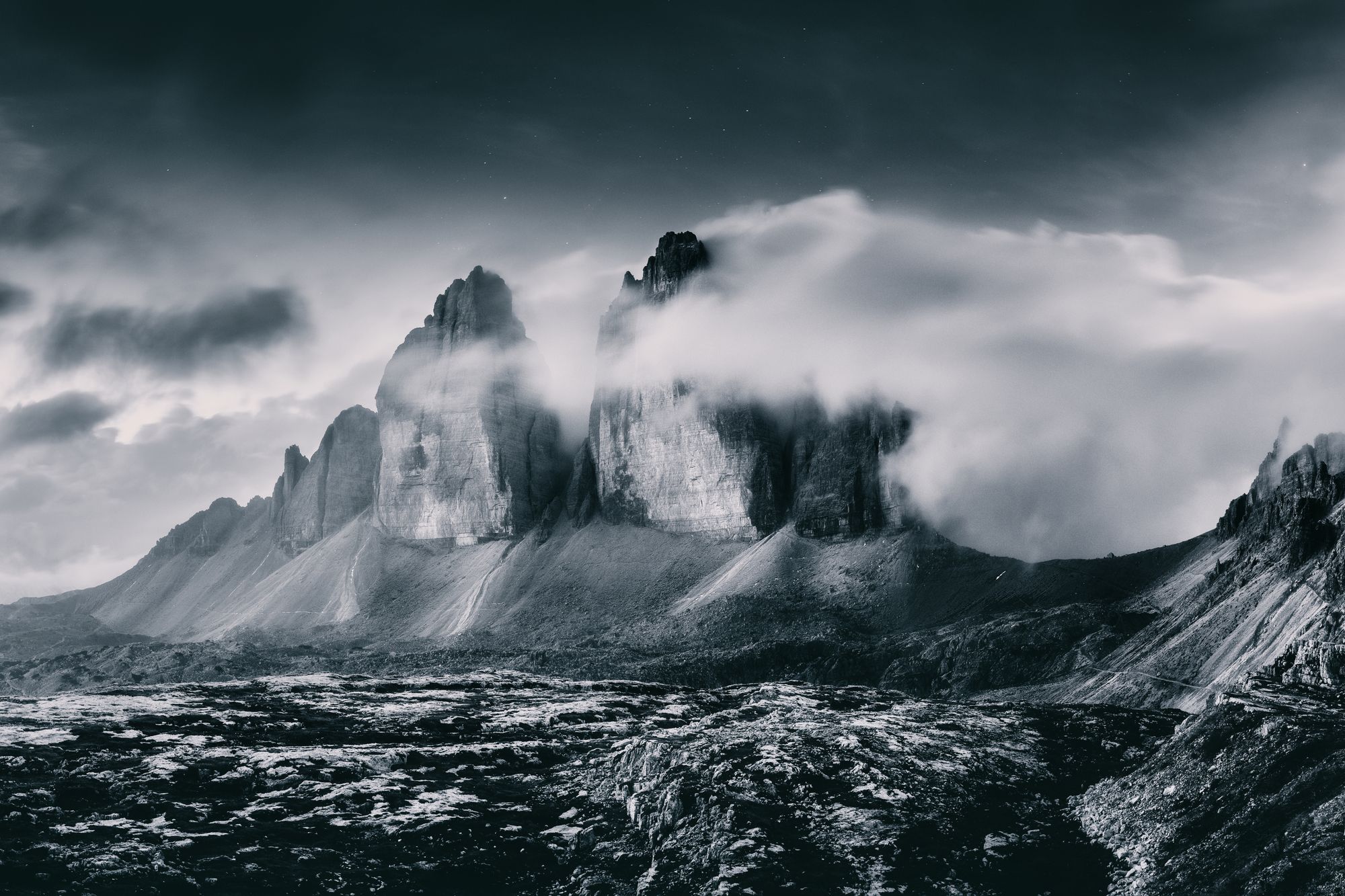 Mountain peaks emerging through low cloud